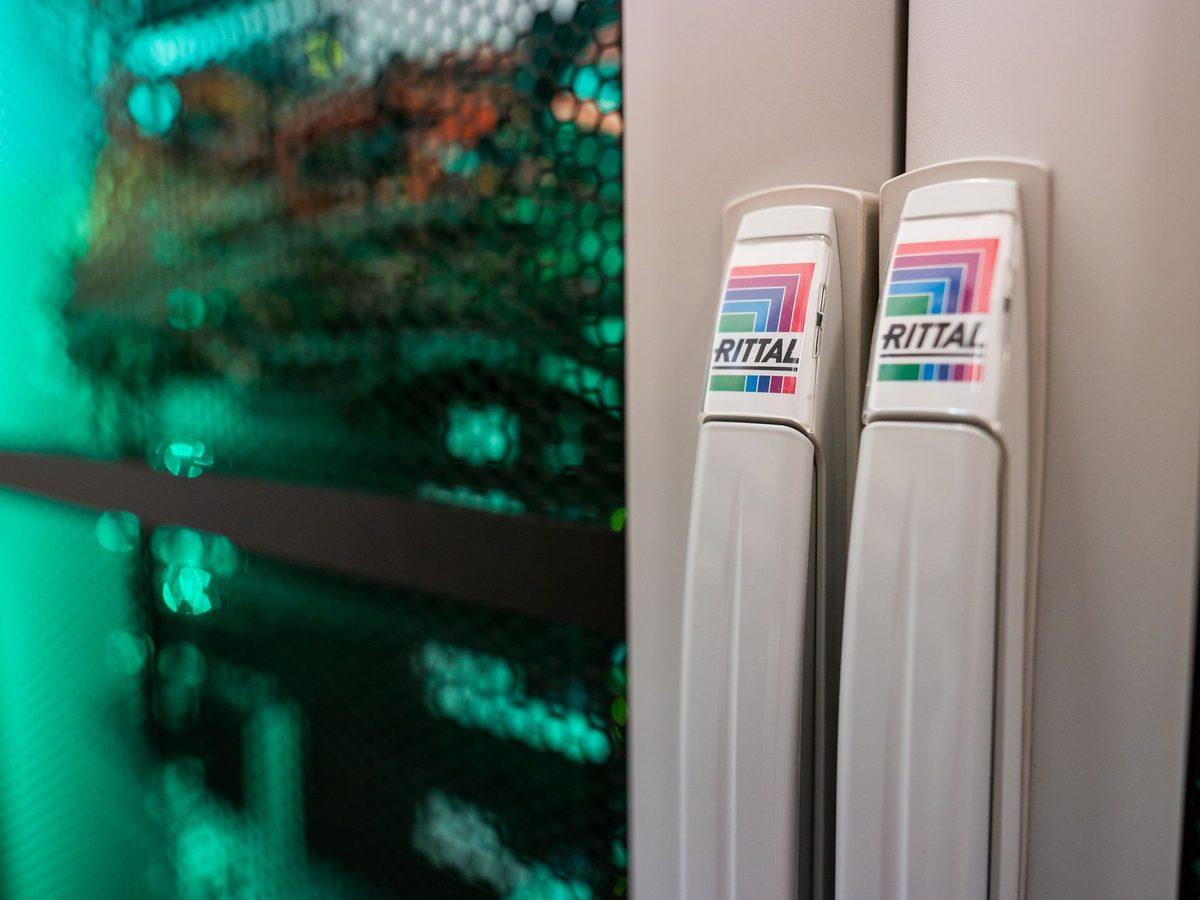 Server racks under green lighting – the ALTEPRO server room