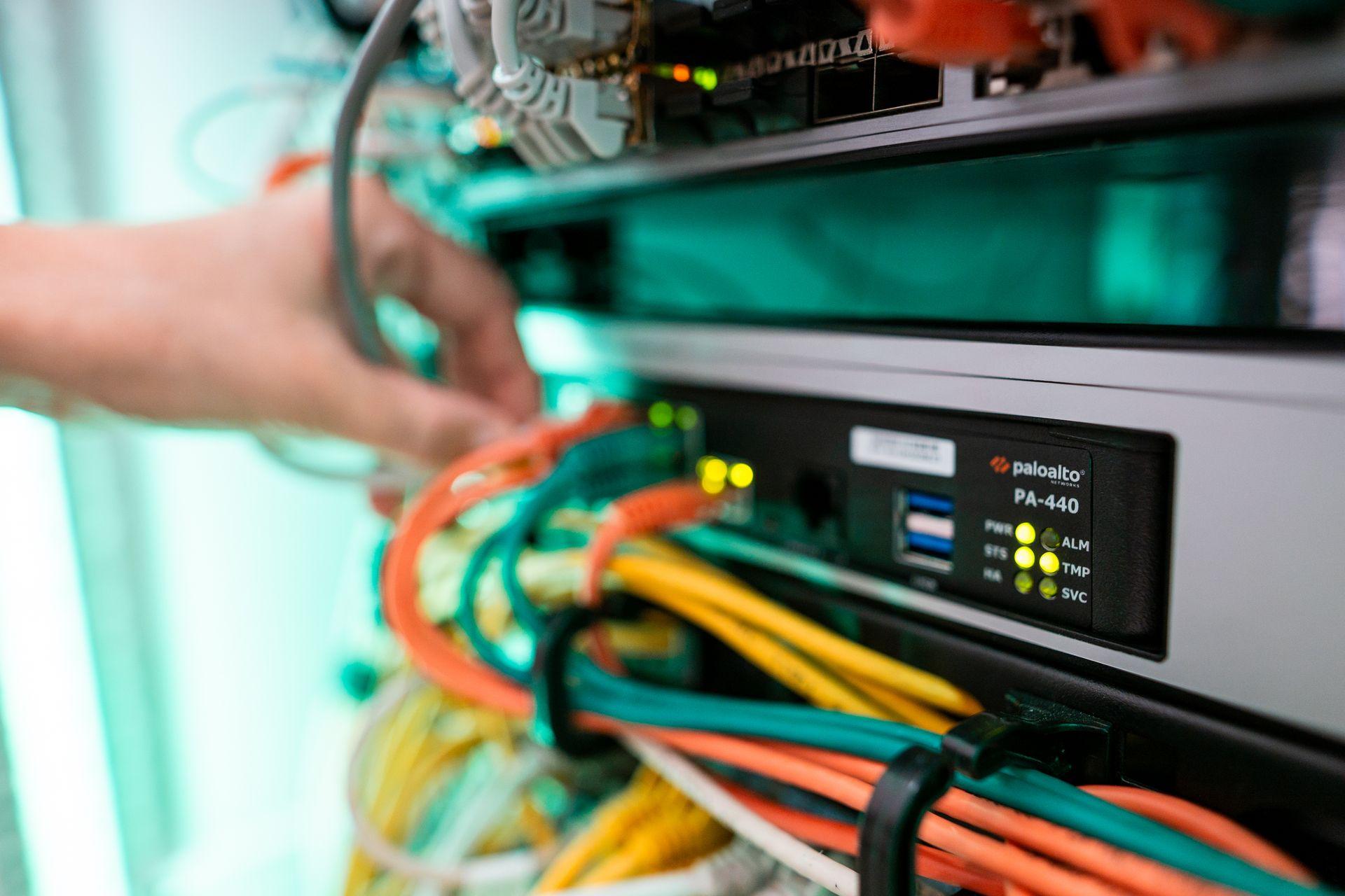 An ALTEPRO engineer working on network infrastructure